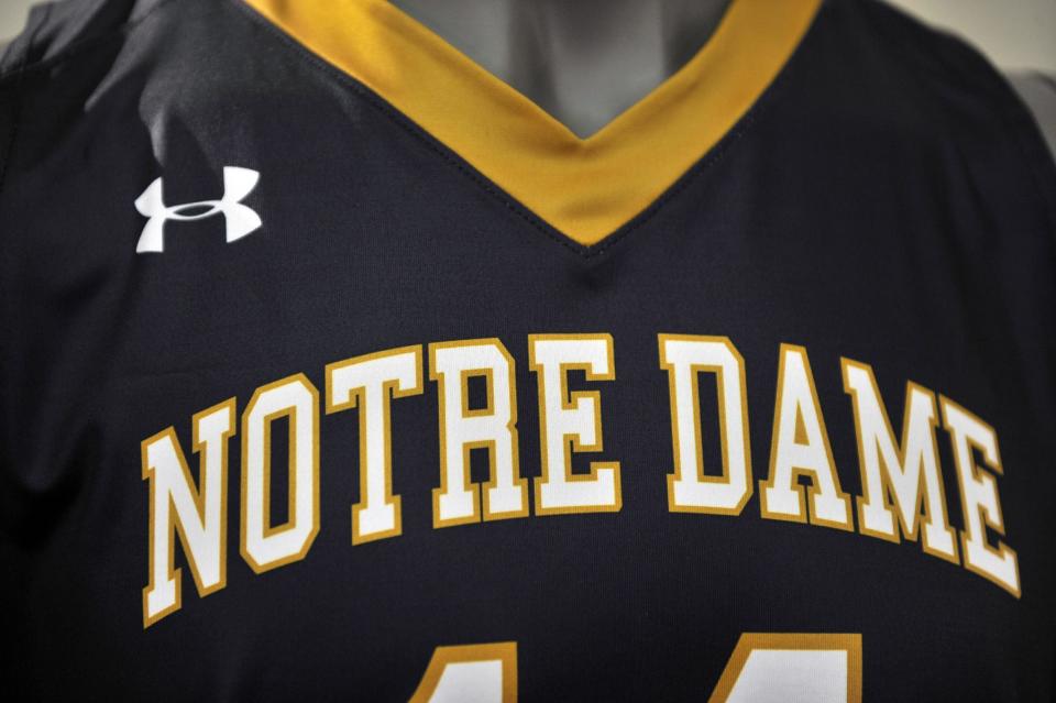 A new Notre Dame basketball uniform is displayed at a news conference Tuesday Jan. 21, 2014, in South Bend, Ind., announcing an agreement between Notre Dame and Under Armour that will outfit the university's athletic teams (AP Photo/Joe Raymond)