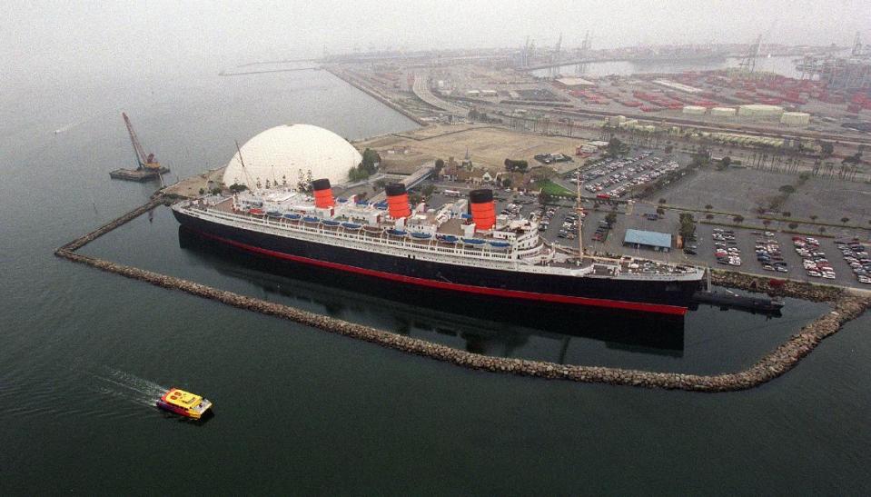 FILE - This April 14, 2002 file photo shows photo shows the retired Cunard ocean liner Queen Mary at its permanent mooring in the harbor at Long Beach, Calif. A survey has found the ship is so corroded that it's at urgent risk of flooding, and the price tag for fixing up the 1930s ocean liner could near $300 million. Documents obtained the Long Beach Press-Telegram show it would take five years to rehab the ship. Engineers who compiled the survey warn that the vessel is probably "approaching the point of no return." (Jeff Gritchen/Long Beach Press-Telegram/SCNG via AP, File)