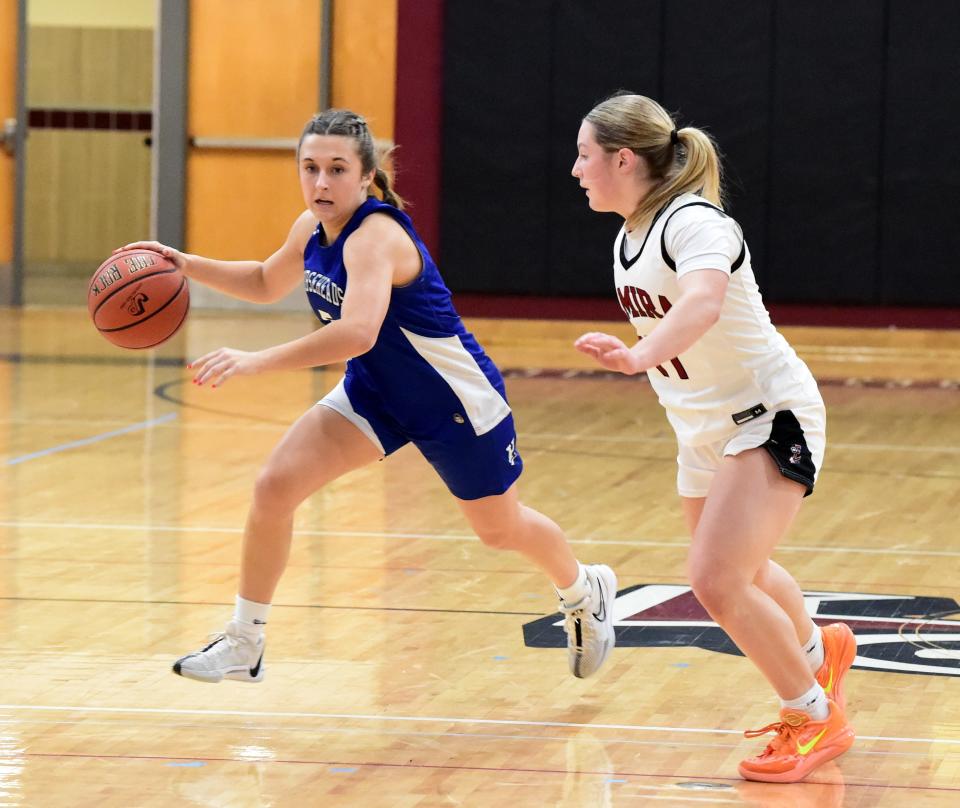 Horseheads' Sophia Bonnell is defended by Elmira's Addison Taft during the Blue Raiders' 52-37 win in the fifth-place game of the Girls Division at the Josh Palmer Fund Clarion Classic on Dec. 30, 2023 at Ernie Davis Academy in Elmira.