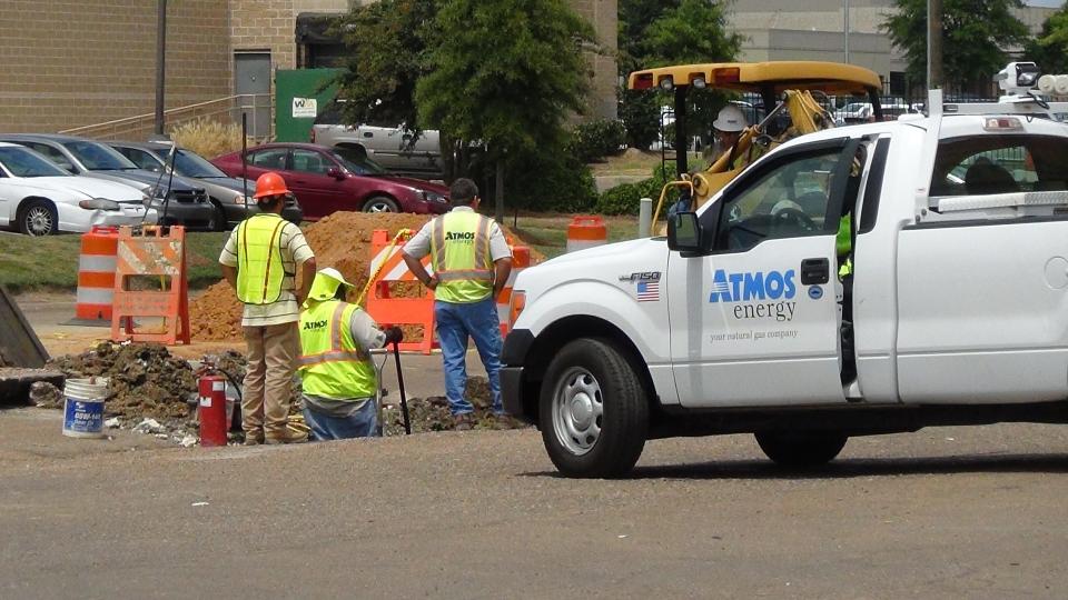Atmos Energy workers are shown in this file photo.