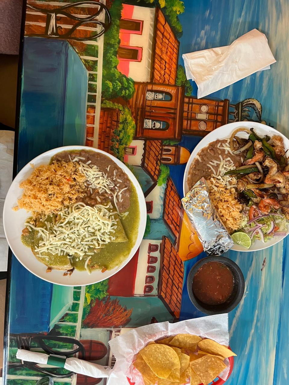 Camarones a la plancha (butterfly grilled shrimp with onion, bell peppers and mushrooms), right, and enchiladas verde at El Jaliciense.