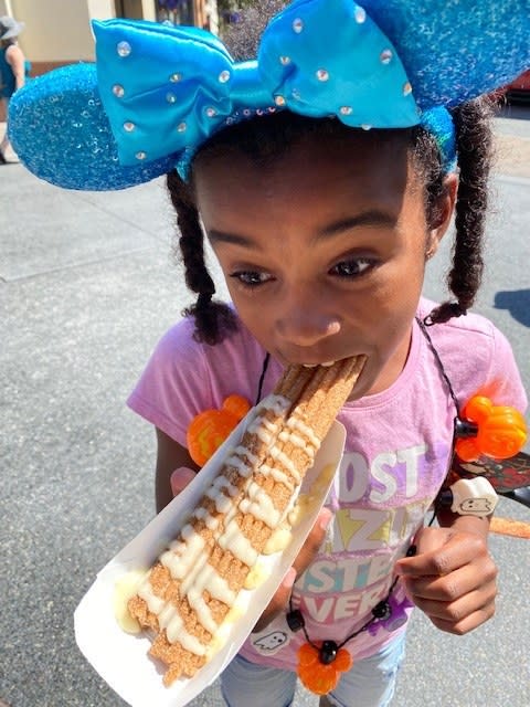 author's daughter taking a bite