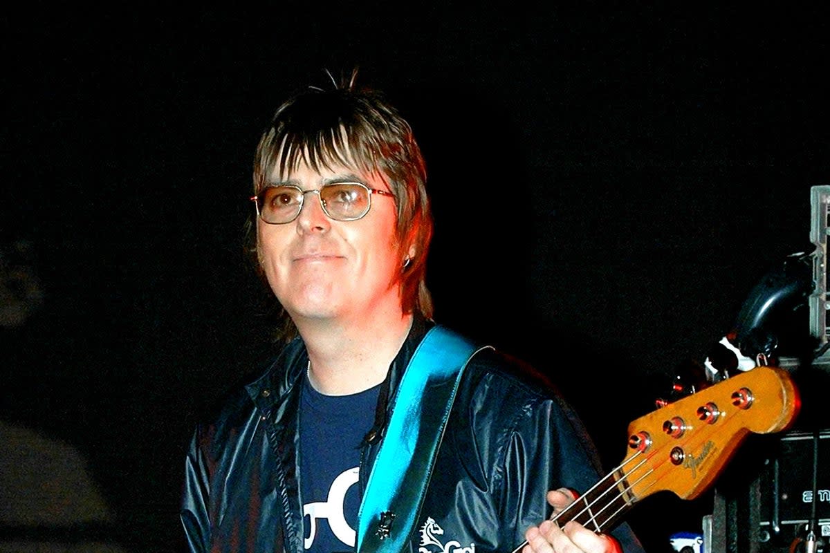 Andy Rourke on stage with Badly Drawn Boy during the Manchester Versus Cancer charity concert in 2006 (PA) (PA Archive)