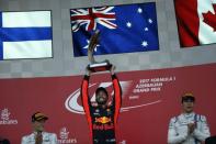 Formula One - F1 - Azerbaijan Grand Prix - Baku, Azerbaijan - June 25, 2017. Red Bull Racing Formula One driver Daniel Ricciardo of Australia celebrates his victory over second placed Mercedes' Valtteri Bottas and third placed Williams' Lance Stroll. REUTERS/David Mdzinarishvili