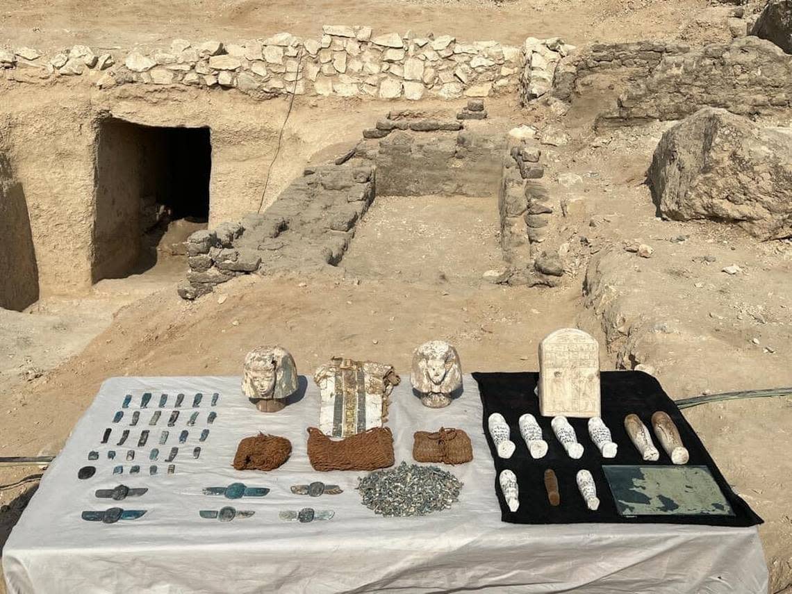 The funerary artifacts laid out on a table.