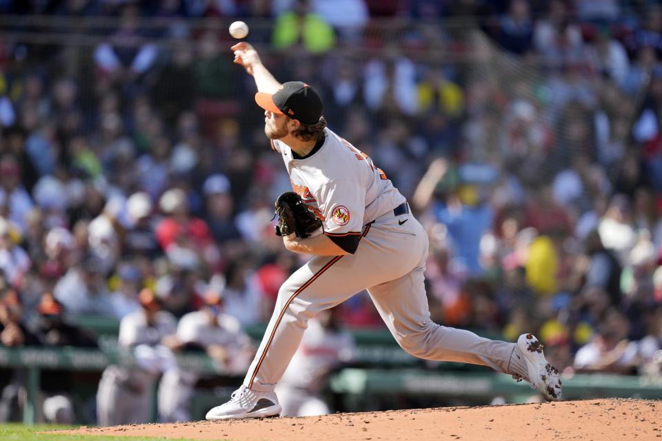 Baltimore Orioles' Corbin Burnes pitches against the Boston Red Sox during the second inning of an opening-day baseball game at Fenway Park, Tuesday, April 9, 2024, in Boston. (AP Photo/Michael Dwyer)