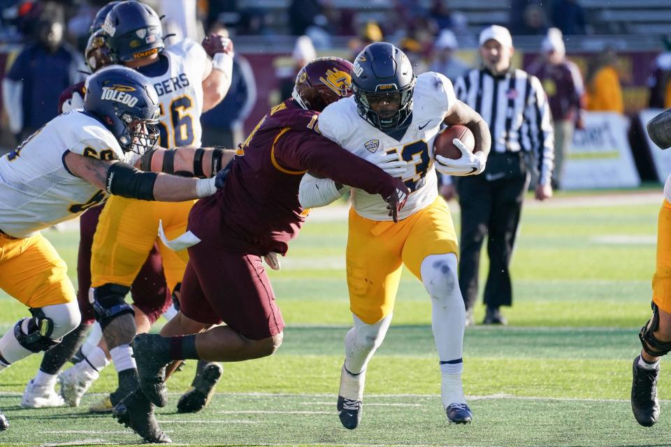 Toledo running back Penny Boone runs the ball against Central Michigan during the fourth quarter of CMU's 32-17 loss on Friday, Nov. 24, 2023, in Mount Pleasant.