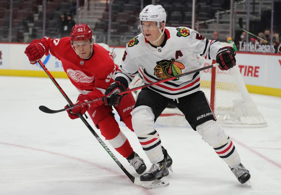 Red Wings center Vladislav Namestnikov skates against Blackhawks defenseman Connor Murphy during the first period on Thursday, April 15, 2021, at Little Caesars Arena.