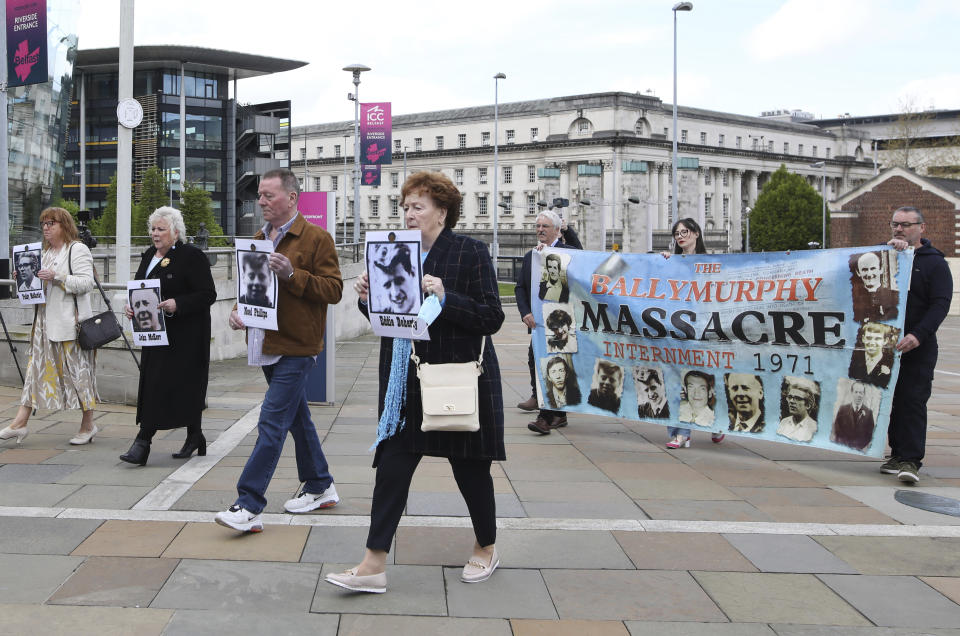 Relatives arrive for the inquest into the Ballymurphy shooting, in Belfast, Northern Ireland, Tuesday May 11, 2021. The findings of the inquest into the deaths of 10 people during an army operation in August 1971 is due to be published on Tuesday. (AP Photo/Peter Morrison)