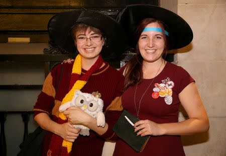 Fans in costume queue at an event to mark the release of the book of the play of Harry Potter and the Cursed Child parts One and Two at a bookstore in London, Britain July 30, 2016. REUTERS/Neil Hall