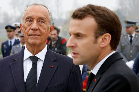 French President Emmanuel Macron and Portuguese President Marcelo Rebelo de Sousa attend a World War One remembrance ceremony of the battle of la Lys at the WW1 Portuguese cemetery in Richebourg, France, April 9, 2018. REUTERS/Pascal Rossignol/Pool