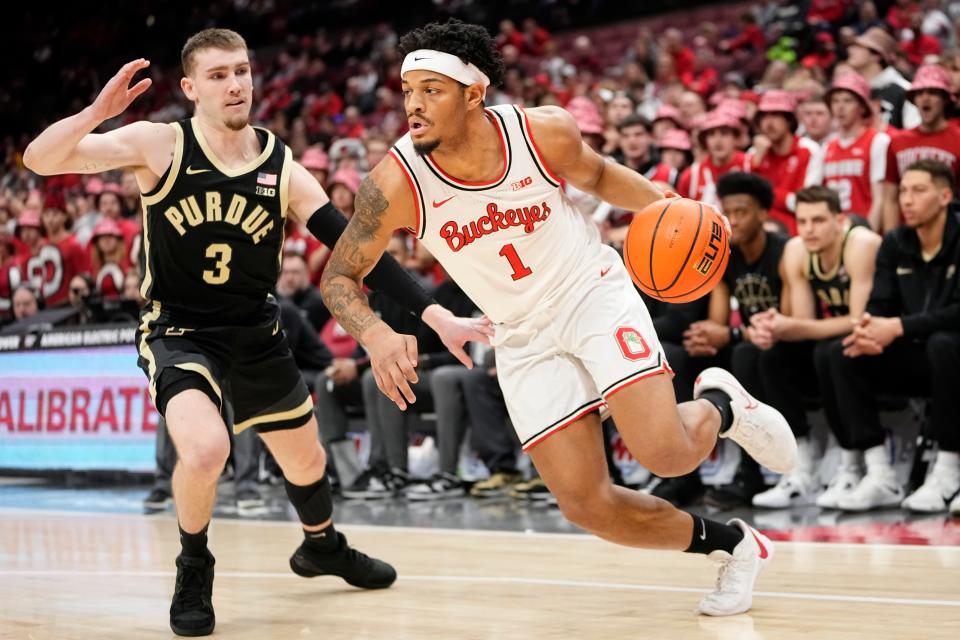 Feb 18, 2024; Columbus, Ohio, USA; Ohio State Buckeyes guard Roddy Gayle Jr. (1) drives past Purdue Boilermakers guard Braden Smith (3) during the first half of the NCAA men’s basketball game at Value City Arena.
