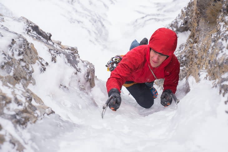 Ian Welsted climbs a goulotte of ice along the Icefields Parkway, Alberta.