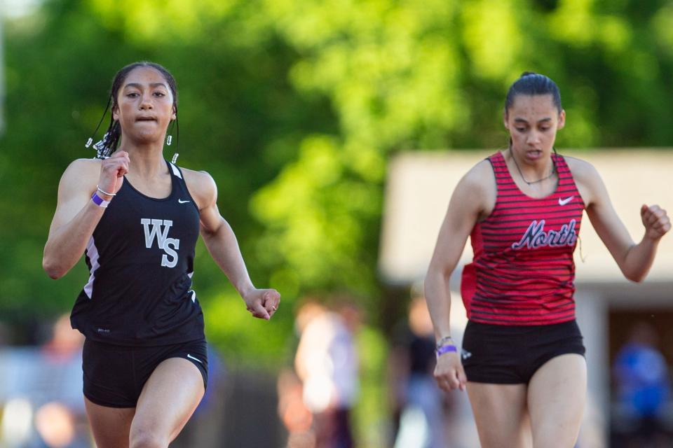 West Salem's Olivia Jolivette, left, wins the 100 meters during the CVC Track and Field District Championships at McCulloch Stadium on Friday, May 10, 2024, in Salem.