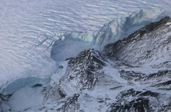 The ice fields of Ellesmere Island, Canada, are retreating due to warming temperatures.