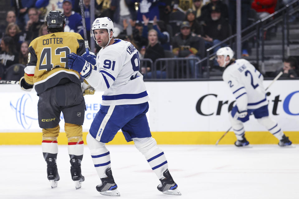 Toronto Maple Leafs center John Tavares (91) reacts after scoring a goal against the Vegas Golden Knights during the first period of an NHL hockey game Thursday, Feb. 22, 2024, in Las Vegas. (AP Photo/Ian Maule)