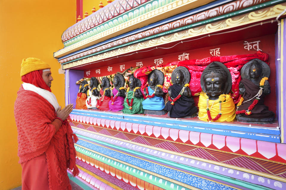 A Hindu high priest Mukundanad prays at the famed Adi Shankaracharya monastery, in Joshimath, in India's Himalayan mountain state of Uttarakhand, Jan.19, 2023. For decades, scientists have warned that the holy town, built on piles of debris left behind from years of landslides and earthquakes, could not withstand heavy construction. A report from 1976 said that Joshimath's location along a slope and over a geological fault line made it inherently unstable. Its foundation of loose top soil and soft rocks had a carrying limit. (AP Photo/Rajesh Kumar Singh)