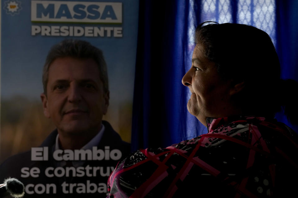 Cristina Bramajo takes part in an interview backdropped by a campaign poster promoting Economy Minister Sergio Massa, the ruling party’s presidential candidate, at an office run by the Evita Movement, a Peronist social organization, in Cuidad Evita on the outskirts of Buenos Aires, Argentina, Monday, Nov. 13, 2023. Bramajo said, “I am a Peronist and, come what may, I will always vote for Peronism.”(AP Photo/Natacha Pisarenko)