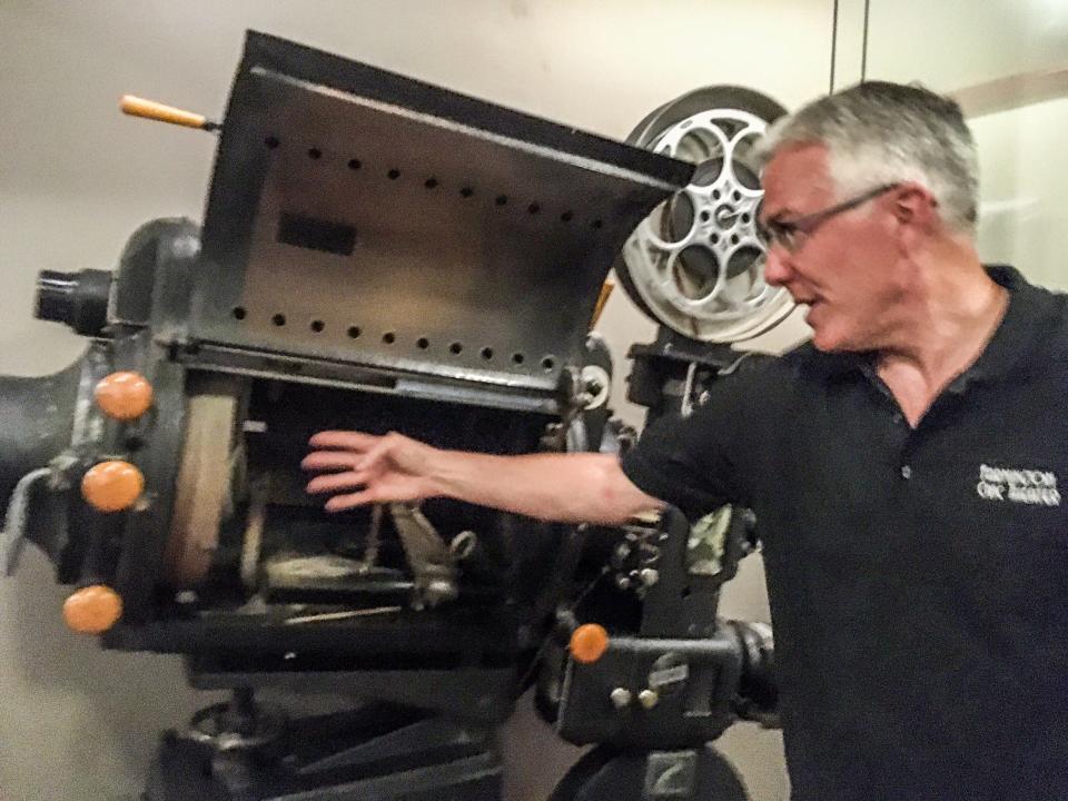 A massive projector, long out of use, is among the artifacts on display at the Farmington Civic Theater.