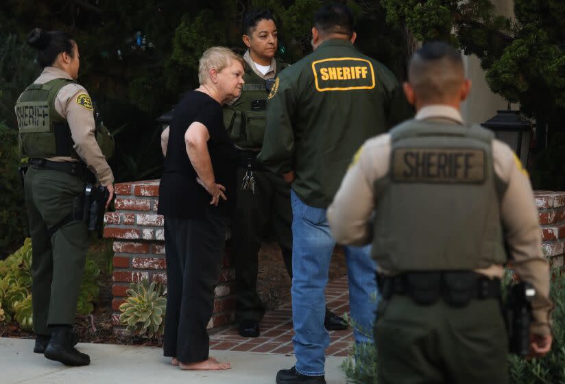SANTA MONICA, CA - SEPTEMBER 14, 2022 - - Los Angeles Supervisor Shelia Kuehl's stands in front of her home after being escorted out by Los Angeles County sheriffs who served her with a search warrant in Santa Monica on September 14, 2022. This was part of a criminal investigation into a county contract awarded to a nonprofit organization. Sheriff's investigators also searched Patti Giggans' house, her nonprofit's offices, officers at the L.A. County Hall of Administration and the headquarters of the county's Metropolitan Transportation Authority, which awarded a contract to Giggans' Peace Over Violence." (Genaro Molina / Los Angeles Times)