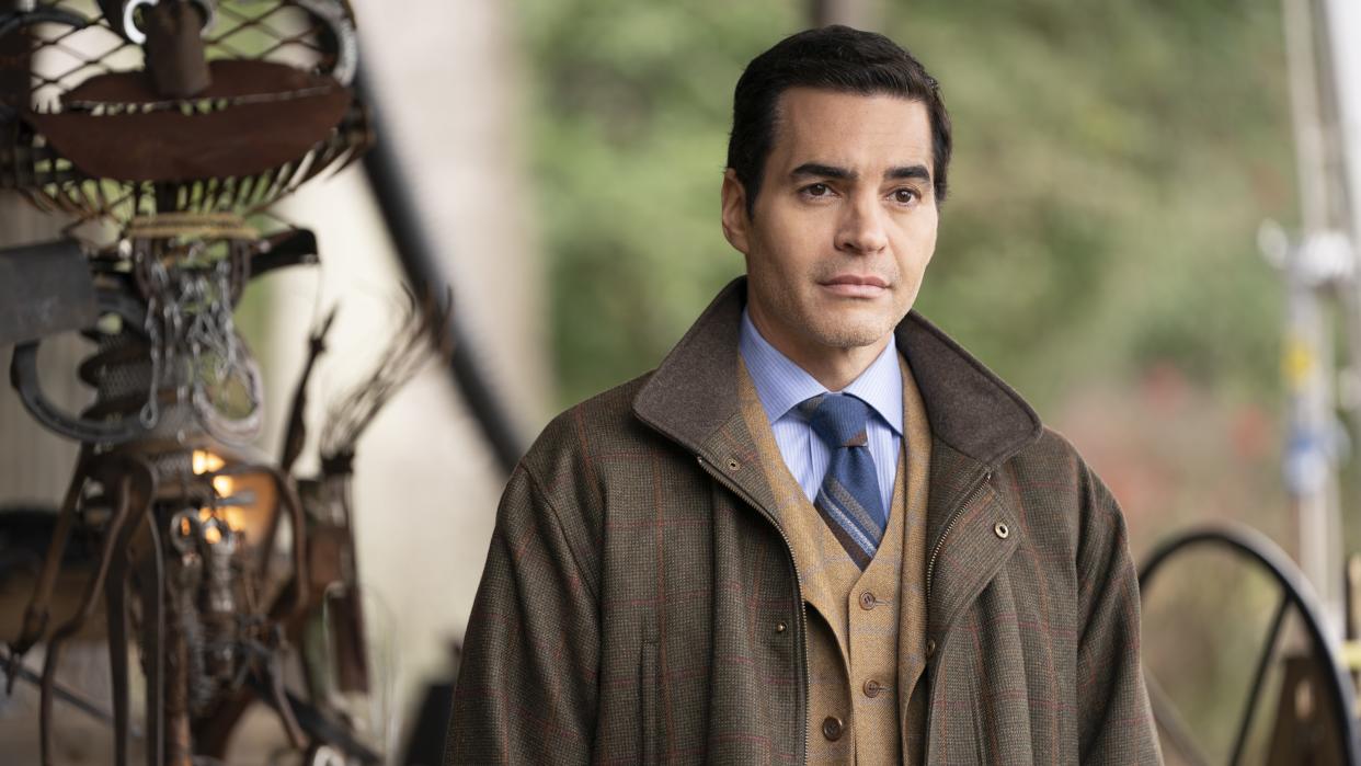  Ramón Rodríguez as Will Trent in a brown coat in Will Trent season 2 . 