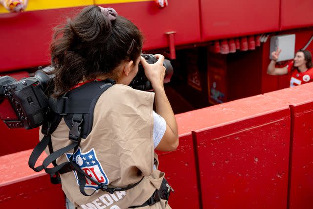 <p>Nick Wagner</p> Emily Curiel capturing a photo of Tommy Townsend