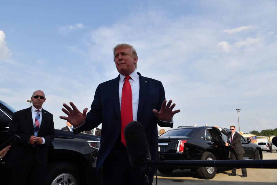 President Donald Trump speaks to reporters as he arrives at Pitt-Greenville Airport in Greenville, North Carolina, on July 17, 2019.