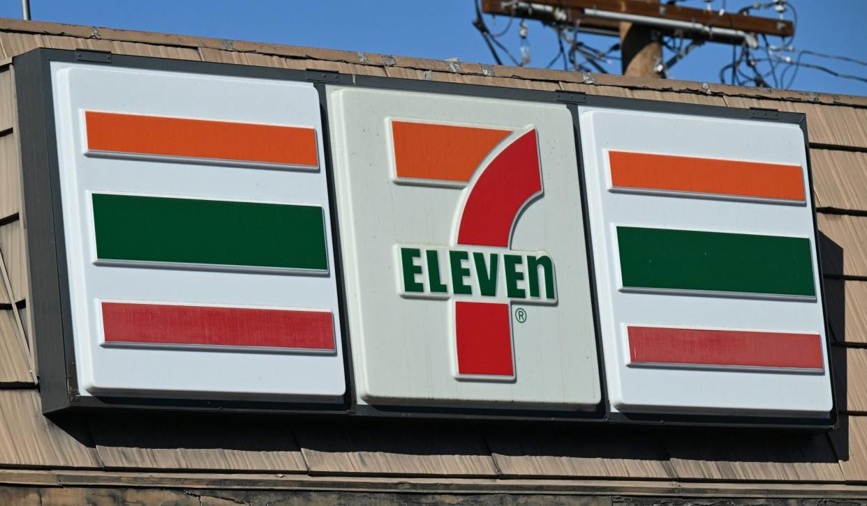 A sign outside a 7-Eleven store in seen in Glendale, California, July 11, 2022. - At least four robbery-shootings in the early morning hours of July 11, 2022 took place at southern California 7-Eleven stores, leaving two people dead and others injured, according to police. Authorities say the shootings appear to be related. (Photo by Robyn Beck / AFP) (Photo by ROBYN BECK/AFP via Getty Images)