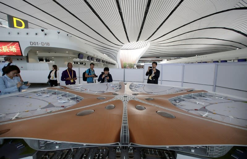 A building model of the terminal hall is displayed at the newly launched Daxing International Airport on the outskirts of Beijing