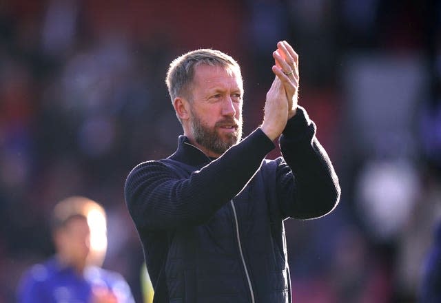 Graham Potter applauds the Chelsea fans after a game against Crystal Palace