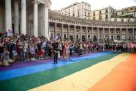 <p>Piazza del Plebiscito during the Napoli Pride flash mob on 27 June in Naples, Italy. The Pride flash mob was dedicated to Sarah Hijazi, the Egyptian activist arrested, imprisoned and tortured after flying a rainbow flag at a Mashrou Leila music concert in Cairo in 2017.</p>