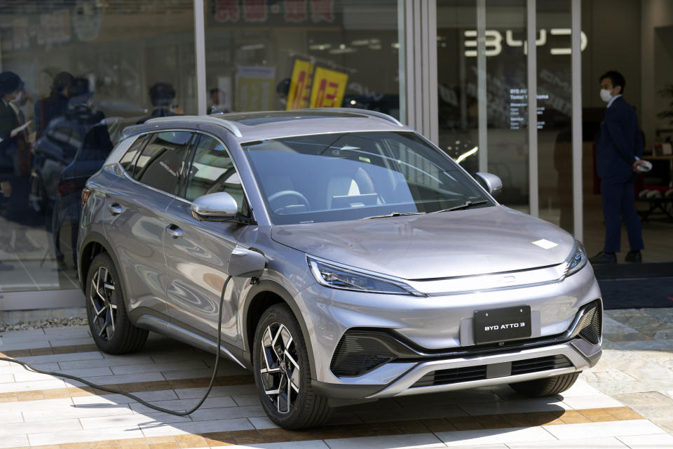 A BYD ATTO 3 electric sports utility vehicle gets charged as it is displayed at a BYD dealership on April 4, 2023, in Yokohama near Tokyo. BYD Auto is part of a wave of Chinese electric car exporters that are starting to compete with Western and Japanese brands in their home markets. They bring fast-developing technology and low prices that Tesla Inc.'s chief financial officer says “are scary.” (AP Photo/Eugene Hoshiko)