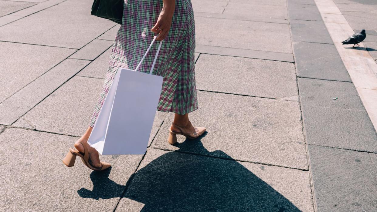 anonymous businesswoman walking on the street after work