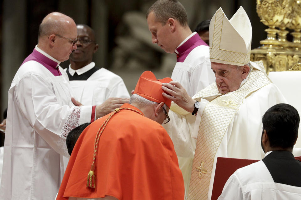 FILE - Cardinal Alvaro Ramazzini receives the red three-cornered biretta hat from Pope Francis inside St. Peter's Basilica, at the Vatican, Oct. 5, 2019. (AP Photo/Andrew Medichini, File)