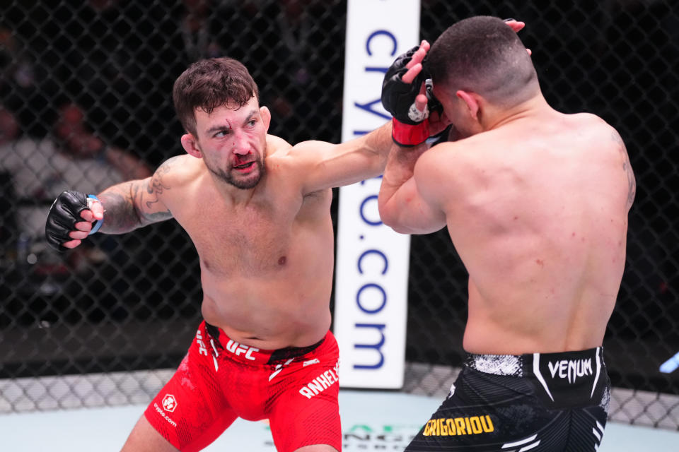 LAS VEGAS, NEVADA – MARCH 16: (L-R) Chad Anheliger of Canada punches Charalampos Grigoriou of Cyprus in their bantamweight fight during the UFC Fight Night event at UFC APEX on March 16, 2024 in Las Vegas, Nevada. (Photo by Jeff Bottari/Zuffa LLC via Getty Images)