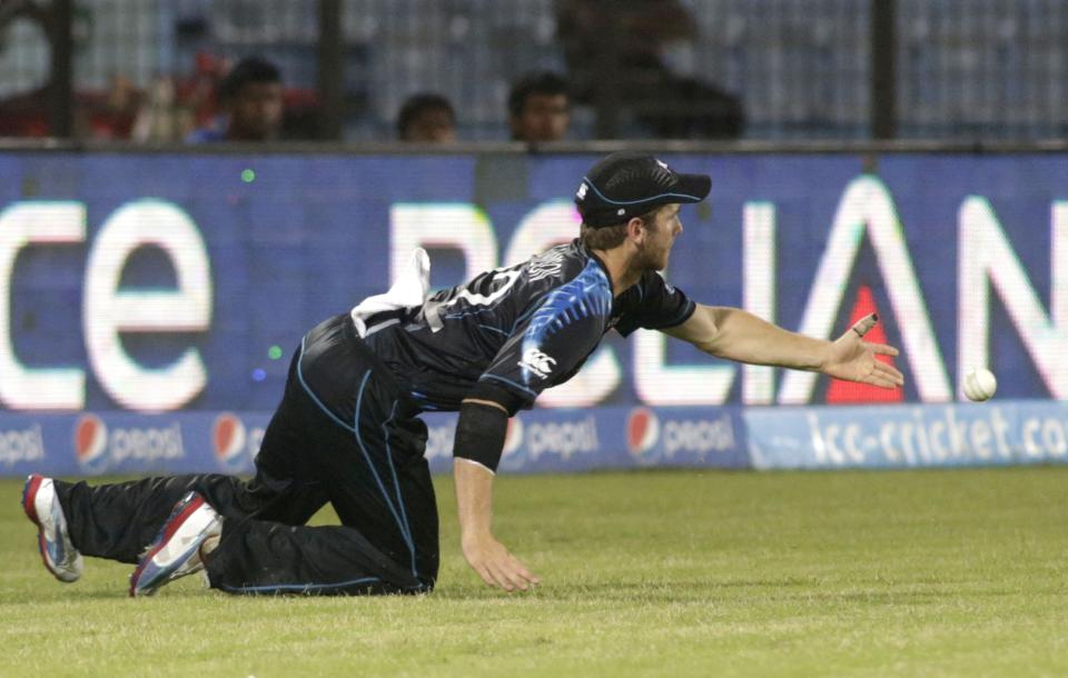 CAPTION CORRECTS PLAYER NAME - New Zealand's Kane Williamson fields the ball during an ICC Twenty20 Cricket World Cup match against England in Chittagong, Bangladesh, Saturday, March 22, 2014. (AP Photo/Bikas Das)