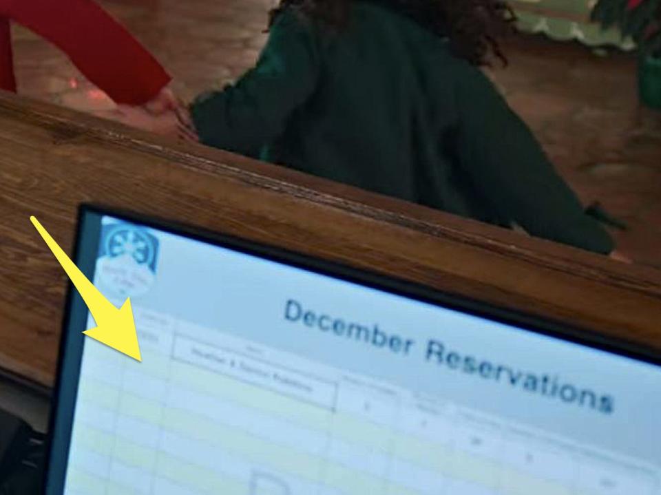 yellow arrow pointing to an empty reservation log on jakes computer in falling for christmas