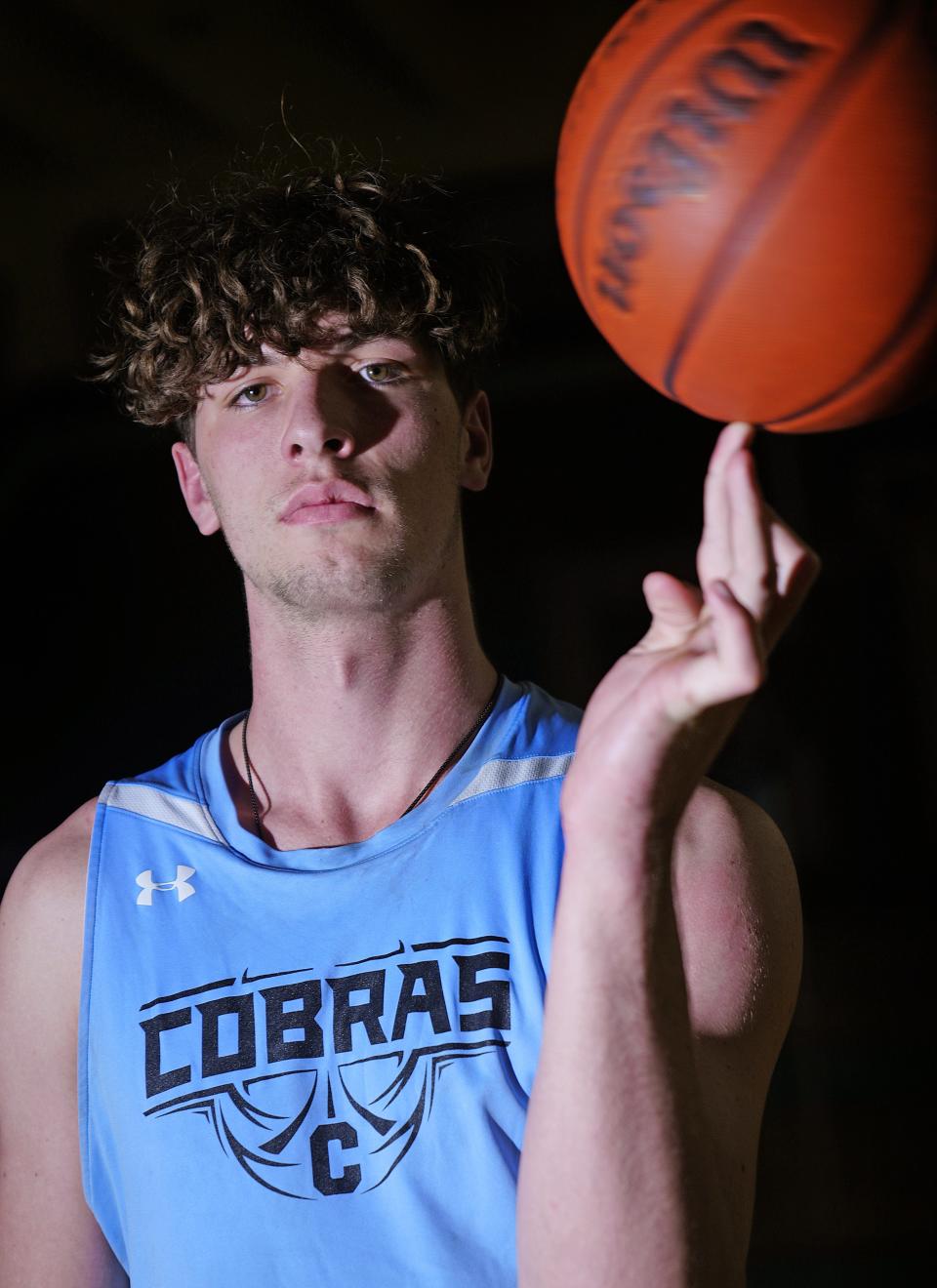 December 13, 2022; Glendale, Ariz; USA; Cactus center Bradey Henige poses for pictures in the gym at Cactus High School.