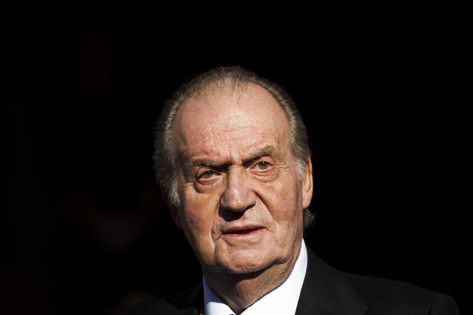 FILE - In this Tuesday, Dec. 27, 2011, file photo, Spain's King Juan Carlos leaves after the official opening of the Parliament, in Madrid. Spain’s Supreme Court said Wednesday Jan. 14, 2015, it will investigate a paternity claim filed against former King Juan Carlos by a Belgian woman alleges she is his daughter and was born after her mother had a relationship with him in the 1960s while he was crown prince.  Carlos while king was immune from criminal prosecution and civil lawsuits, but lost immunity after he abdicated in June 2014. (AP Photo/Daniel Ochoa de Olza, File)