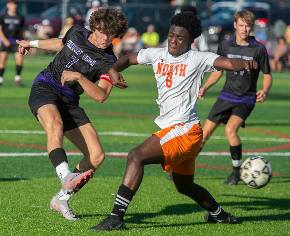 Blackstone Valley Technical School junior captain Matthew Drons takes a shot against Worcester North senior Glenn Anim at the NEFC Field in Mendon, Oct. 5, 2023.