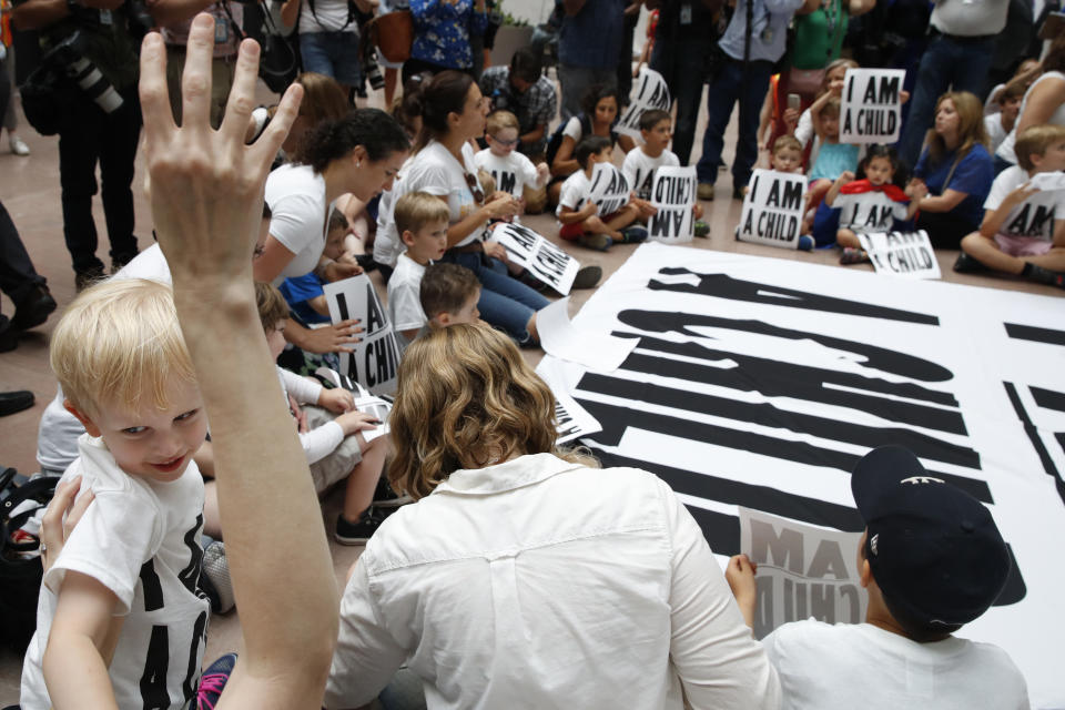 Families protest the separation of immigrant families with a sit-in at the Hart Senate Office Building, Thursday, July 26, 2018, on Capitol Hill in Washington. The Trump administration faces a court-imposed deadline Thursday to reunite thousands of children and parents who were forcibly separated at the U.S.-Mexico border, an enormous logistical task brought on by its "zero tolerance" policy on illegal entry. (AP Photo/Jacquelyn Martin)