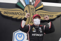 Josef Newgarden celebrates after winning an IndyCar auto race at Indianapolis Motor Speedway, Friday, Oct. 2, 2020, in Indianapolis. (AP Photo/Darron Cummings)