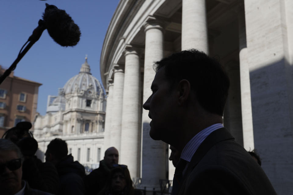 Juan Carlos Cruz talks to journalists prior to the start of a meeting with organizers of the summit on preventing sexual abuse at the Vatican, Wednesday, Feb. 20, 2019. A dozen survivors of clergy sexual abuse met with organizers of Pope Francis' landmark summit on preventing abuse and protecting children. Chilean survivor Juan Carlos Cruz, who was asked by the Vatican to invite survivors to the meeting, told reporters Wednesday that Francis would not be attending, as had been rumored. (AP Photo/Gregorio Borgia)