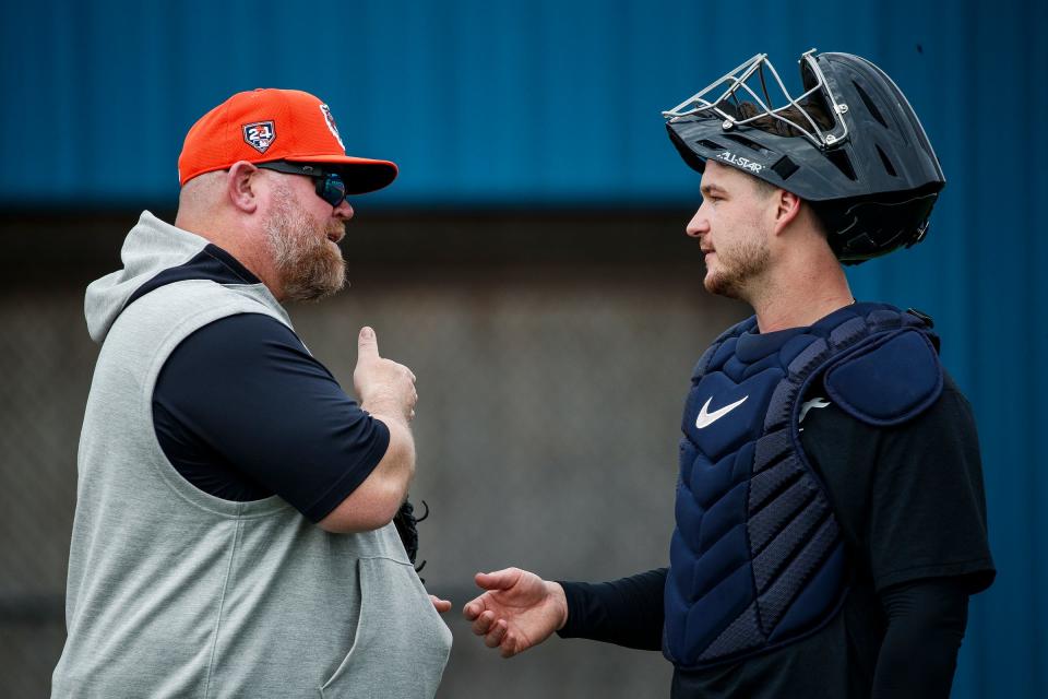 Detroit Tigers catching coach Ryan Sienko, left, talks to catcher Dillon Dingler during spring training at Tigertown in Lakeland, Fla. on Thursday, Feb. 15, 2024.