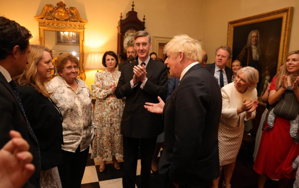 Colleagues including Jacob Rees-Mogg applaud the outgoing Prime Minister - Andrew Parsons/ No 10 Downing Street