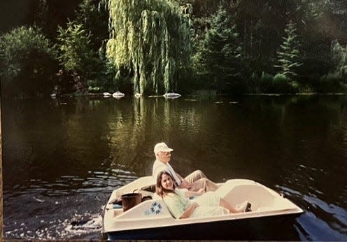 Robert W. Monk III and one of his granddaughters enjoy the pond on the 19 acres of property that he would later donate to a nonprofit group in Wausau to create the Robert W. Monk Botanical Gardens. On Friday, the nonprofit announced it was removing Monk's name from the botanical gardens and renaming it the Wausau Botanic Gardens.