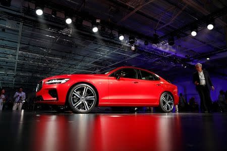 Members of the media look over the Volvo S60 during the inauguration of Volvo Cars first U.S. production plant in Ridgeville, South Carolina, U.S., June 20, 2018. REUTERS/Randall Hill