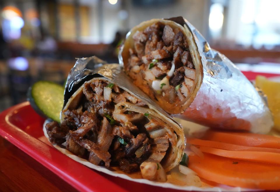 Taqueria El Fundador's Pastor burrito with beans, salsa and onions.