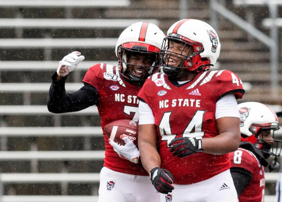 Shyheim Battle and Brandon Cleveland celebrate after Battle scored a touchdown off of an interception during N.C. State football’s spring game at Carter-Finley Stadium on Saturday, April 8, 2023, in Raleigh, N.C.