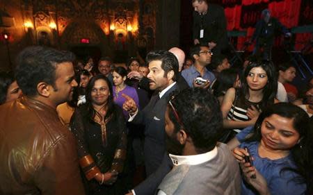 Bollywood actor Anil Kapoor (C) speaks with participants of a workshop ahead of the 15th International Indian Film Academy Awards in Tampa, Florida April 24, 2014. REUTERS/Mohammed Jaffer-SnapsIndia